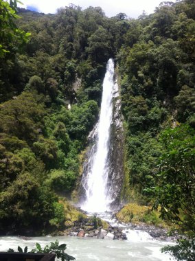 Waterfall in Haast River on the West coast of South Island, New Zealand.
