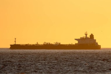 Tanker Saetta in dawn light on Skagerrak off Skagen, Denmark.