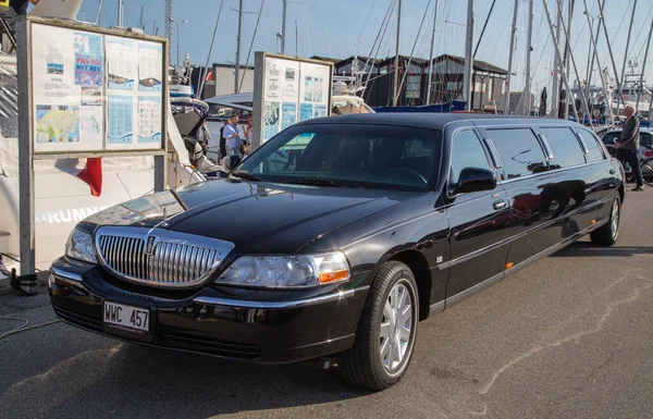 Limousine and sailboats at the harbor in Skagen, North Jutland, Denmark.