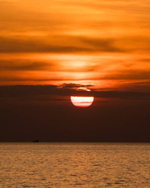 Sunset over the Andaman Sea, seen from the island of Koh Lanta in southern Thailand. clipart