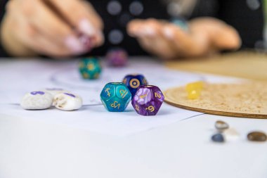 Woman numerologist astrologer counts numbers. Selective focus. People.