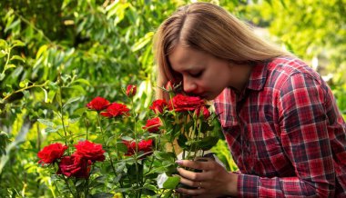 A young woman is allergic to flowers. Selective focus