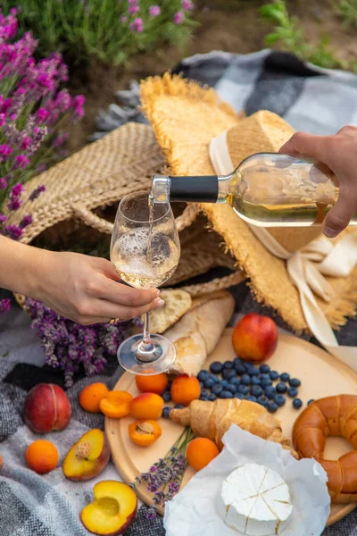 stock image wine, fruits, berries, cheese, glasses picnic in lavender field Selective focus Nature