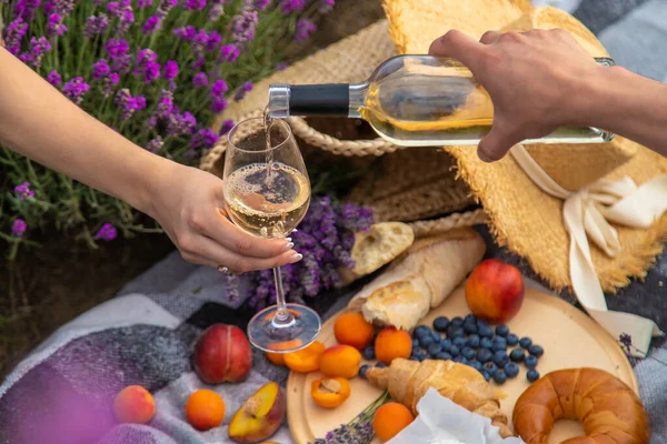 stock image wine, fruits, berries, cheese, glasses picnic in lavender field Selective focus Nature