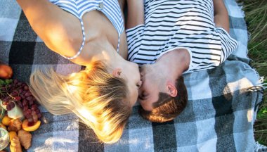 couple in love on a picnic in the park. Nature. Selective focus