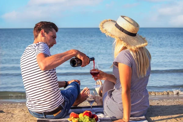 stock image Romantic couple enjoying wine by the sea. Selective focus