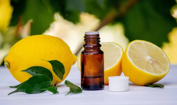 lemon oil in jars, fresh lemon. Selective focus. Nature