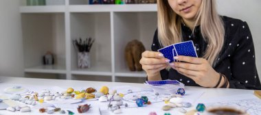 Woman astrologer draws a natal chart. Selective focus. People.