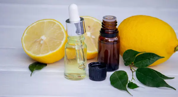 lemon oil in jars, fresh lemon. Selective focus. Nature