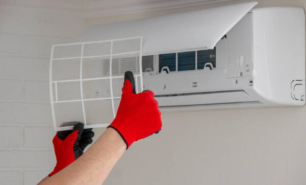 air conditioner filter replacement HVAC maintenance clean air ventilation.