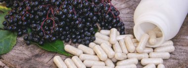 Doğal ilaçlar, kapsüller ve böğürtlenden yapılan bağışıklık takviyeleri.