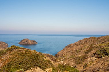 Cap de Creus Alt Emporda, Spain. February 2023 Rugged rocky coastline with turquoise waters in contrast. Sharp rocks extend out to the sea, creating a dramatic and wild texture.