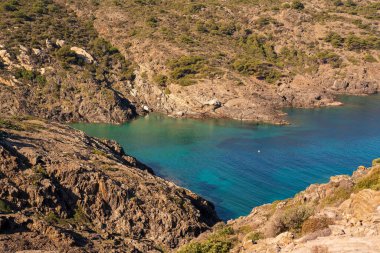 Cap de Creus Alt Emporda, Spain. February 2023 Rugged rocky coastline with turquoise waters in contrast. Sharp rocks extend out to the sea, creating a dramatic and wild texture.