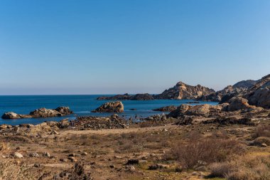 Cap de Creus Alt Emporda, Spain. February 2023 Rugged rocky coastline with turquoise waters in contrast. Sharp rocks extend out to the sea, creating a dramatic and wild texture.