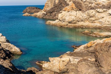 Cap de Creus Alt Emporda, Spain. February 2023 Rugged rocky coastline with turquoise waters in contrast. Sharp rocks extend out to the sea, creating a dramatic and wild texture.