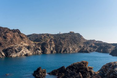 Cap de Creus Alt Emporda, Spain. February 2023 Rugged rocky coastline with turquoise waters in contrast. Sharp rocks extend out to the sea, creating a dramatic and wild texture.
