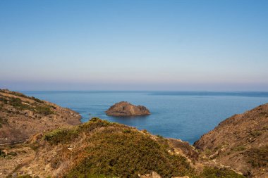 Cap de Creus Alt Emporda, Spain. February 2023 Rugged rocky coastline with turquoise waters in contrast. Sharp rocks extend out to the sea, creating a dramatic and wild texture.