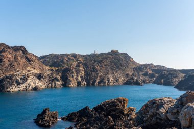 Cap de Creus Alt Emporda, Spain. February 2023 Rugged rocky coastline with turquoise waters in contrast. Sharp rocks extend out to the sea, creating a dramatic and wild texture.
