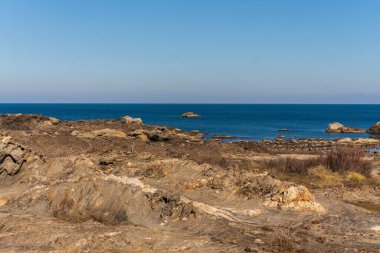 Cap de Creus Alt Emporda, Spain. February 2023 Rugged rocky coastline with turquoise waters in contrast. Sharp rocks extend out to the sea, creating a dramatic and wild texture.