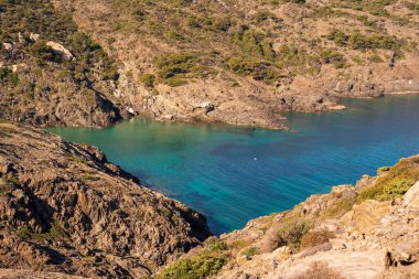 Cap de Creus Alt Emporda, Spain. February 2023 Rugged rocky coastline with turquoise waters in contrast. Sharp rocks extend out to the sea, creating a dramatic and wild texture.