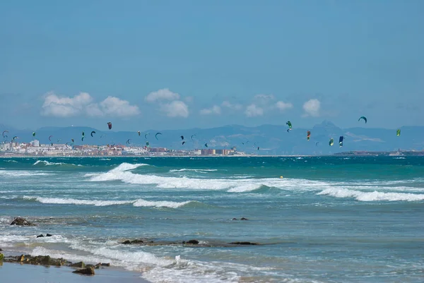 stock image Colorful kites at the coast of the atlantic ocean in Tarifa, a popular spot for kite surfers in Spain