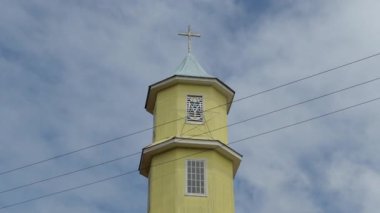 Chiloe, Chile - 12-23-2018: exterior of traditional wooden church and its church tower on chiloe island.
