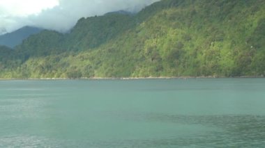 slow motion of a car ferry crossing the fjords of the carretera austral along the pacific coastline in Patagonia, Chile
