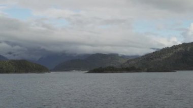 slow motion of a car ferry crossing the fjords of the carretera austral along the pacific coastline in Patagonia, Chile