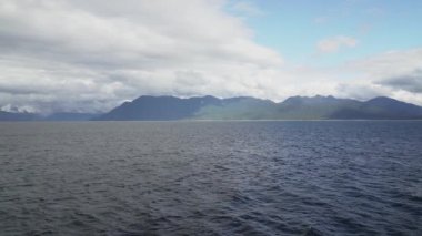slow motion of a car ferry crossing the fjords of the carretera austral along the pacific coastline in Patagonia, Chile