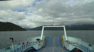 Hornopiren, Chile - 12 27 2018: slow motion of a car ferry crossing the fjords of the carretera austral along the pacific coastline in Patagonia, Chile