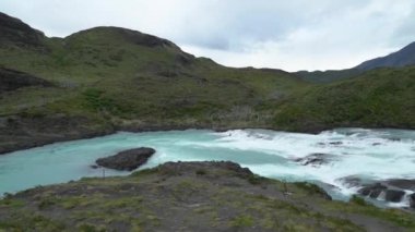 waterfall in the iconic Torres del paine national in Patagonia, Chile, south America, on a cloudy and overcast day.