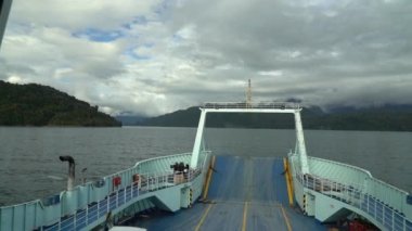 Hornopiren, Chile - 12 27 2018: slow motion of a car ferry crossing the fjords of the carretera austral along the pacific coastline in Patagonia, Chile