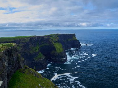 view over the cliffs of Moher in Ireland, a popular hiking destination on a high rock formation at the atlantic coast.