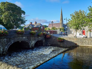 cityscape of an irish town on a sunny day with clear blue sky.