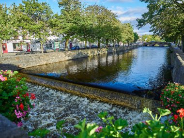 cityscape of an irish town on a sunny day with clear blue sky.