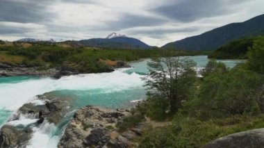 white water rapids at the confluence Rio Baker and Rio Neff with turquoise water along the carretera austral in Patagonia, Chile.