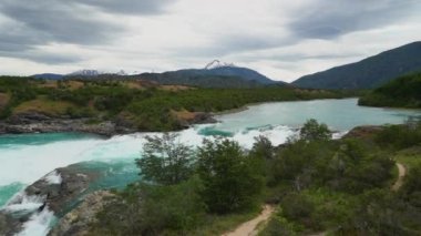 white water rapids at the confluence Rio Baker and Rio Neff with turquoise water along the carretera austral in Patagonia, Chile.