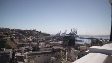 cityscape of the artful and colorful houses of Valparaiso, at the coastline of the pacific ocean in Chile.