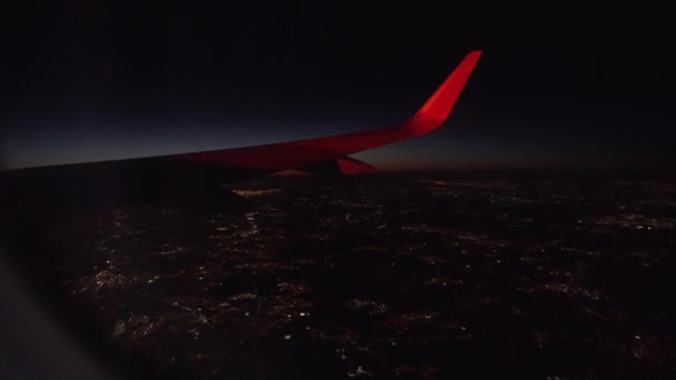 View Out Airplane Window Wing Night Illuminated City Lights — 图库视频影像