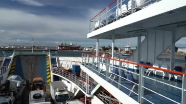 Punta Arenas, Chile - 11 17 2018: car ferry crossing the magellan strait from Punta Arenas to fireland on cloudy and windy day.