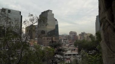 Cityscape of Santiago de Chile, the capital of Chile, at the foot of the andes mountain range, a densely populated metropolis with high sky scrapers in south America.