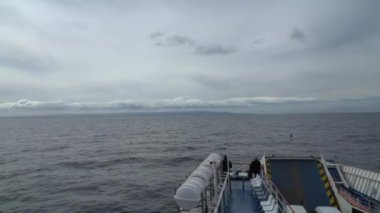 Punta Arenas, Chile - 11 17 2018: car ferry crossing the magellan strait from Punta Arenas to fireland on cloudy and windy day.