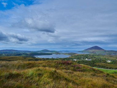 Diamond hill in the landscape of the lush and green Connemara National Park, a popular travel destination for hiking and recreation in Ireland.