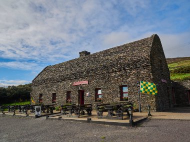 County Kerry, Ireland - 09 21 2015: old historic building at the coastline along the popular and iconic road of the ring of Kerry in Ireland.