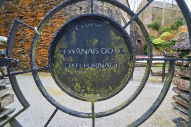 old ancient and historical building with water wheel at Dyfi Furnace, Ceredigion, Wales, clipart