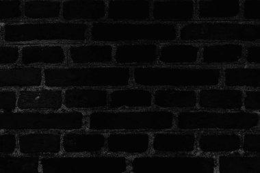 Siyah tuğla desenli soyut bir arka plan. Tuğlaları ve beton dikişleri olan siyah duvar kağıdı..