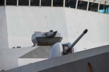 Cannons on board an army warship. Armed battleship close-up.