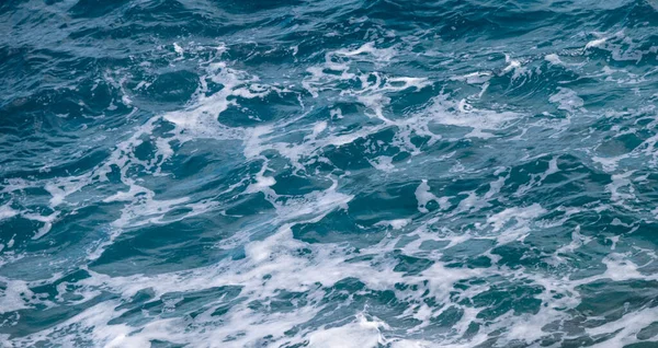 stock image Ocean water background. Blue sea texture with waves and foam.