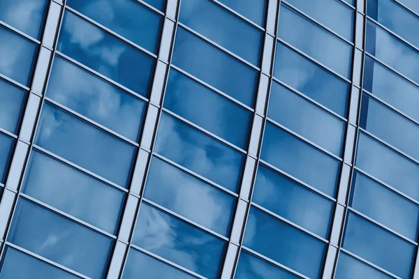 stock image Glass wall background, glass facade texture. Glazed building wall in blue tones