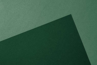 Yeşil tonlar, renkli kağıt dokusu arka planı. Açık yeşil ve koyu yeşil kağıdın soyut arkaplanı.